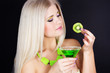 Sexy blonde gorl with green cocktail