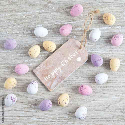 Photo: Tag with "happy easter" and colorful eggs Tag with "happy easter" and colorful eggs