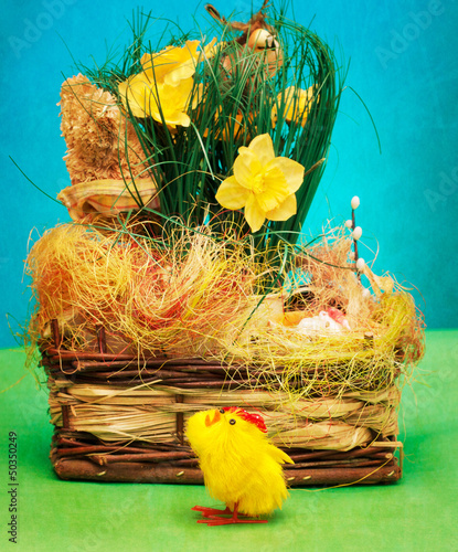 Photo: Vintage basket with easter eggs and little chicken Vintage basket with easter eggs and little chicken
