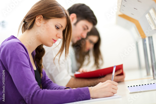 Photo: Young students studying in a library Young students studying in a library