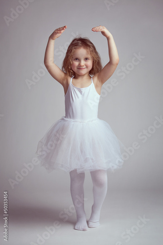Photo: Little girl dancing like a ballerina Little girl dancing like a ballerina