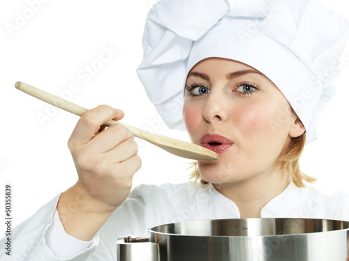 Photo: Female chef cook tasting delicious soup Female chef cook tasting delicious soup
