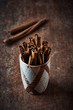 Cinnamon sticks in a ceramic cup
