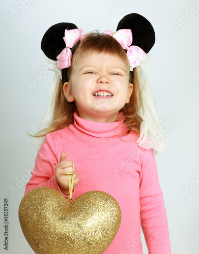 Photo: Beautiful girl with big heart, isolated on white background Beautiful girl with big heart, isolated on white background