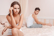 Young couple in a bed bored woman
