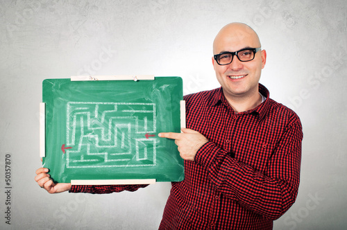 Photo: Man with labyrinth on chalkboard Man with labyrinth on chalkboard