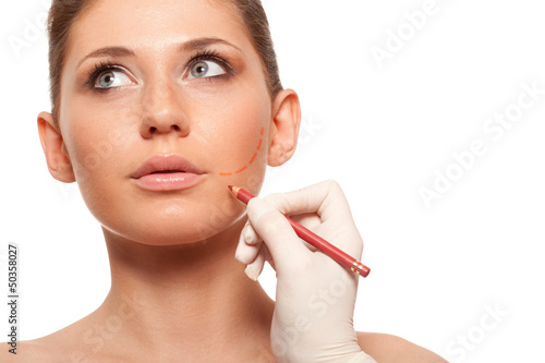 Photo: closeup woman face with surgery mark closeup woman face with surgery mark