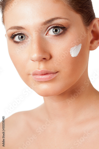 Photo: beautiful woman face with cream beautiful woman face with cream