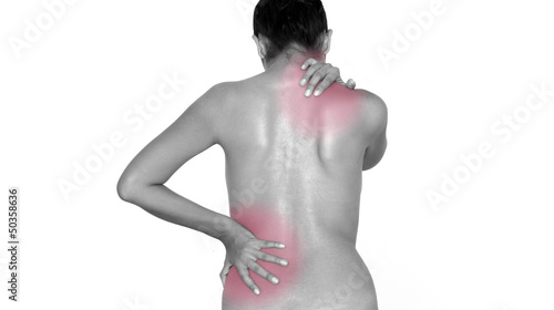 Photo: Woman massaging her back Woman massaging her back