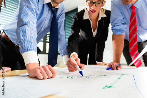 Photo: Business - People in office working as team Business - People in office working as team