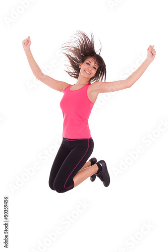 Photo: Weight loss fitness woman jumping of joy Weight loss fitness woman jumping of joy