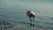 Young men jumping, swimming in the sea, slow motion shot at 240f