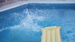 Young man jumping in the swimming pool, slow motion shot at 120f