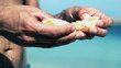 Male hands peeling orange, slow motion shot at 240fps