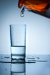 Water is poured into a glass from the filter