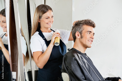 Photo: Hairstylist Setting Client's Hair At Parlor Hairstylist Setting Client's Hair At Parlor