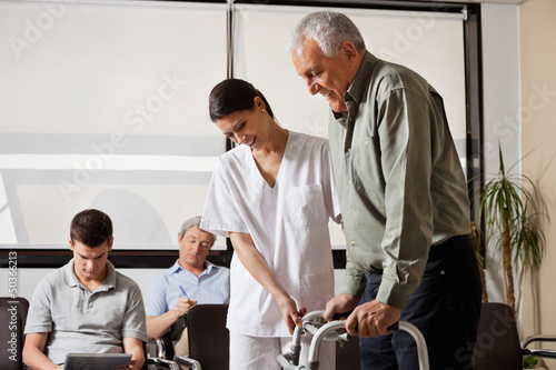 Photo: Man Being Assisted By Nurse To Walk Zimmer Frame Man Being Assisted By Nurse To Walk Zimmer Frame