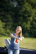 Photo: A young woman tearing up an learner driver plate A young woman tearing up an learner driver plate