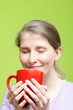 Photo: Woman savouring a mug of hot coffee Woman savouring a mug of hot coffee