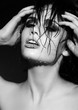 sensual sexy model with wet skin with curly hair