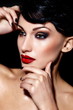 sexy model with bright makeup,with red lips and clean skin
