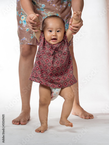 Photo: baby walking assisted baby walking assisted