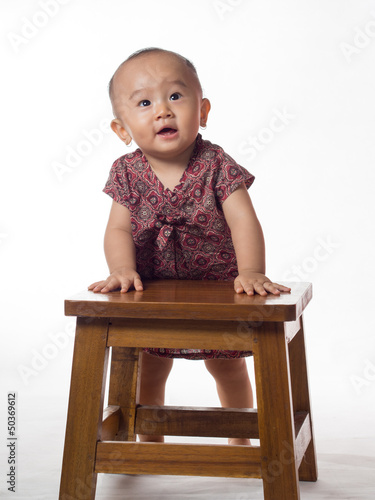 Photo: baby standing looking camera baby standing looking camera
