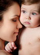 Photo: Young mother hugging baby Young mother hugging baby
