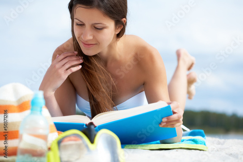 Photo: Reading on the beach Reading on the beach