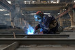 welder with protective equipment