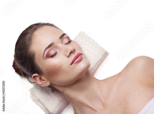 Photo: close-up portrait of a lying young woman close-up portrait of a lying young woman