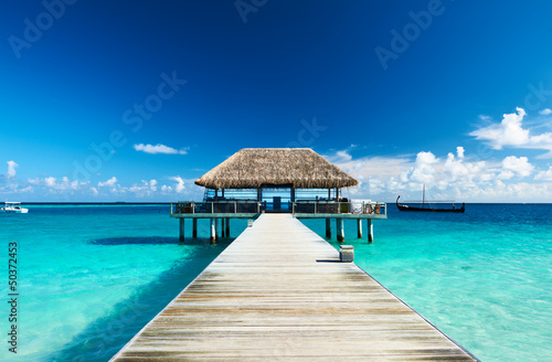 Photo: Beautiful beach with jetty Beautiful beach with jetty