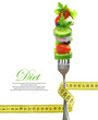Fresh mixed vegetables on fork with measuring tape