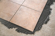 laying floor tiles