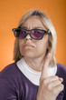 Photo: Young blonde girl threatens finger Young blonde girl threatens finger