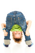 Kind schaut durch seine Beine -Child looking through his legs