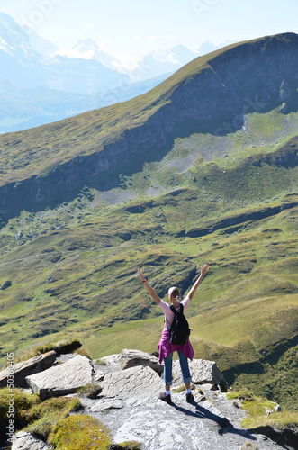 Photo: Traveler on the top of a rock. Jungfrau region, Switzerland Traveler on the top of a rock. Jungfrau region, Switzerland