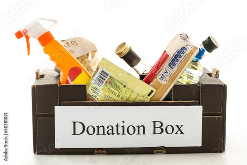 Photo: Black cardboard donation box with houseware product and food Black cardboard donation box with houseware product and food