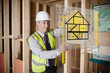 Architect using spirit level and looking at hologram interface