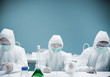 Chemists working in protective suits