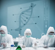 Chemists working in protective suit with futuristic interface sh