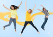 Attractive young man and women jumping for joy