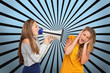 Girl shouting at another through megaphone while she covers her