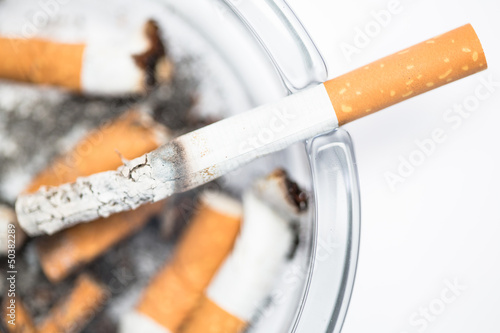 Photo: Close up of cigarette in ashtray Close up of cigarette in ashtray