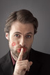 Man with woman lipstick kiss on his cheek - secret love affair
