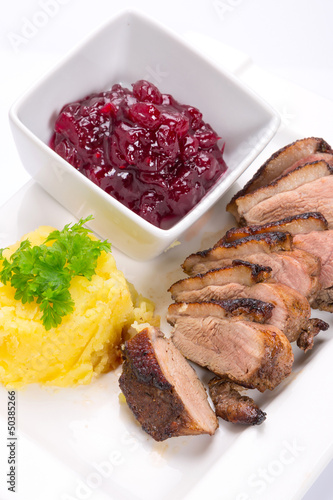 Photo: Roasted duck breast with potatoes and cranberry sauce Roasted duck breast with potatoes and cranberry sauce
