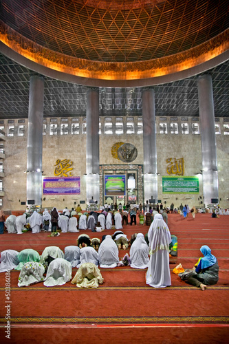 Photo: Muslim praying at Istiqlal Mesjid Mosque. Indonesia Muslim praying at Istiqlal Mesjid Mosque. Indonesia