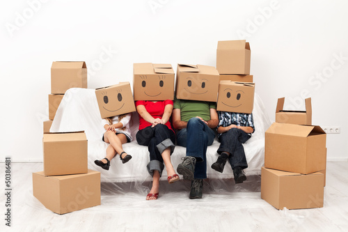 Photo: Happy family in their new home concept Happy family in their new home concept
