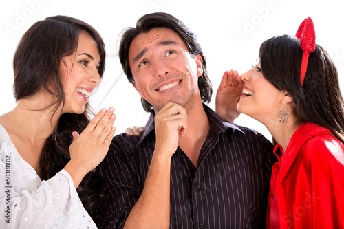 Photo: Man getting advice from and angel and devil Man getting advice from and angel and devil