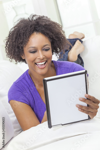 Photo: Mixed Race African American Girl Using Tablet Computer Mixed Race African American Girl Using Tablet Computer